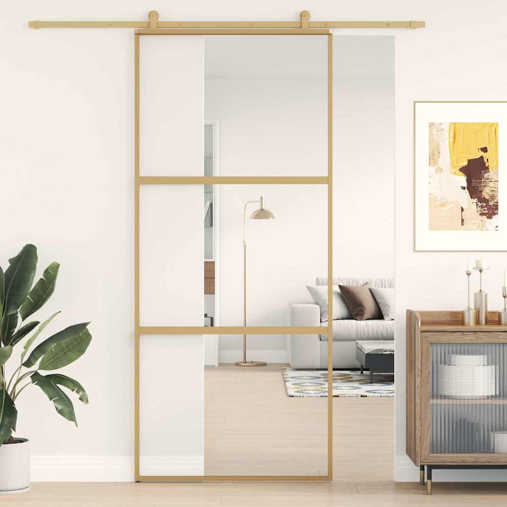 Porte coulissante dorée en verre ESG transparent et aluminium 