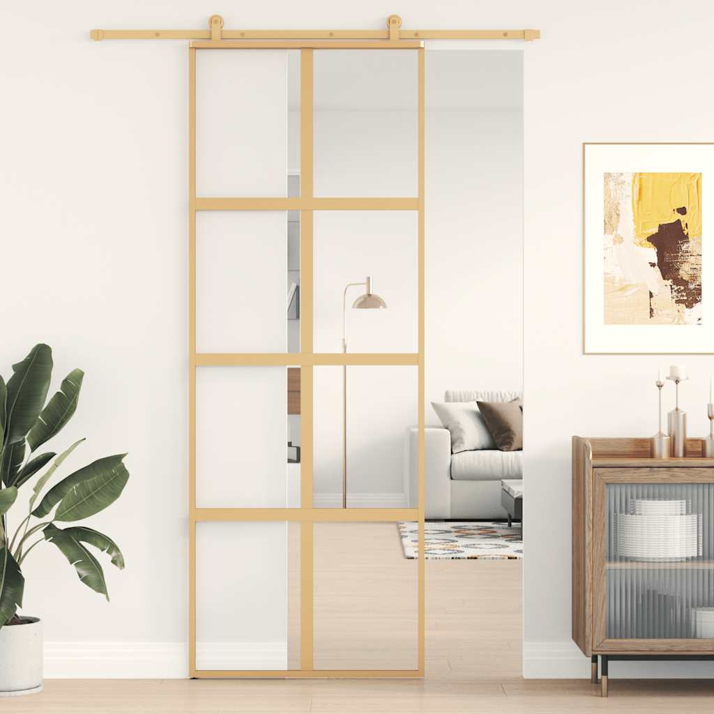 Porte coulissante dorée en verre ESG transparent et aluminium 