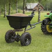 Esparcidor remolcable 29 L con tractor cortacésped